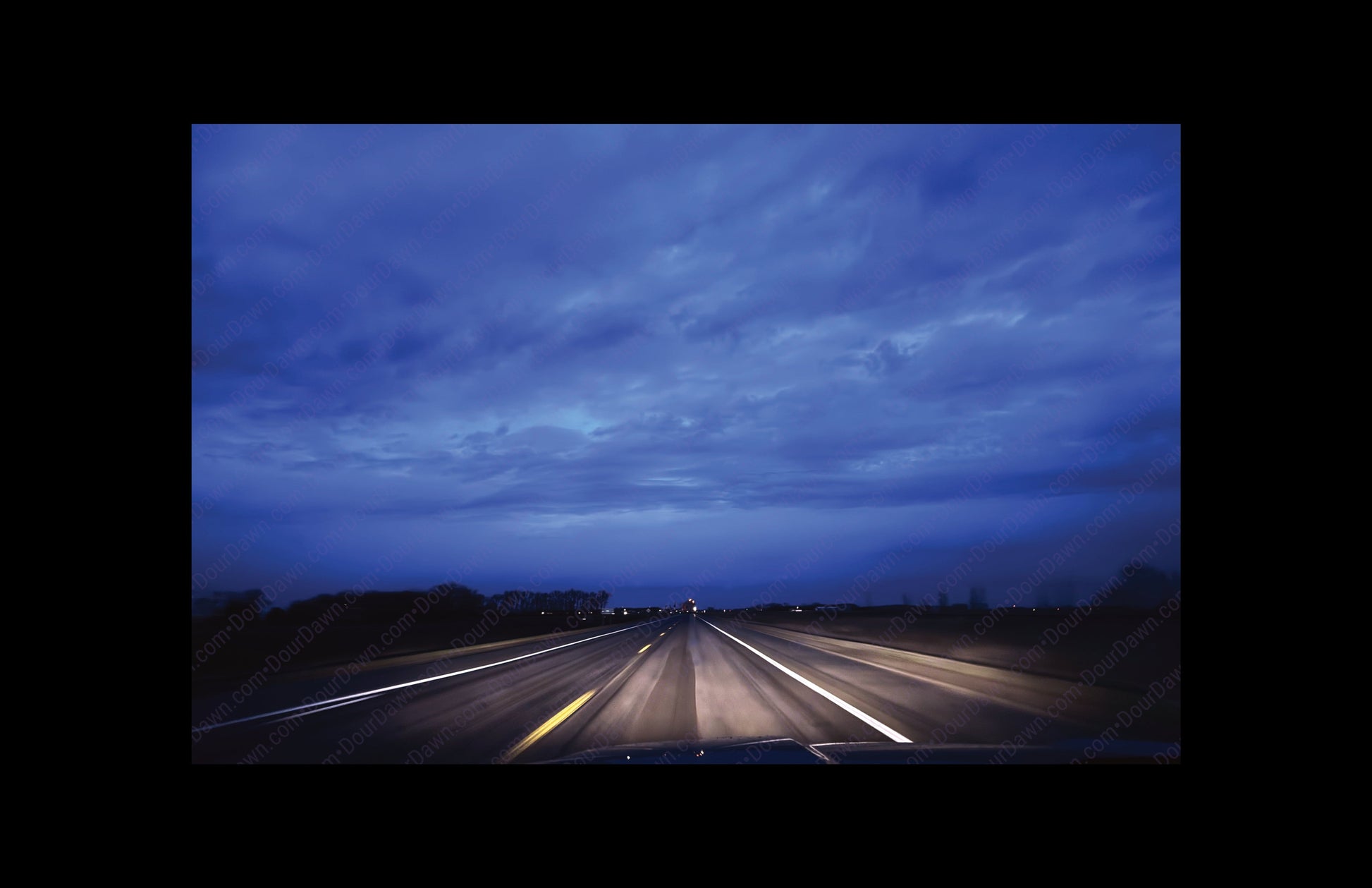 Fine art print of large clouds over road.  Print view