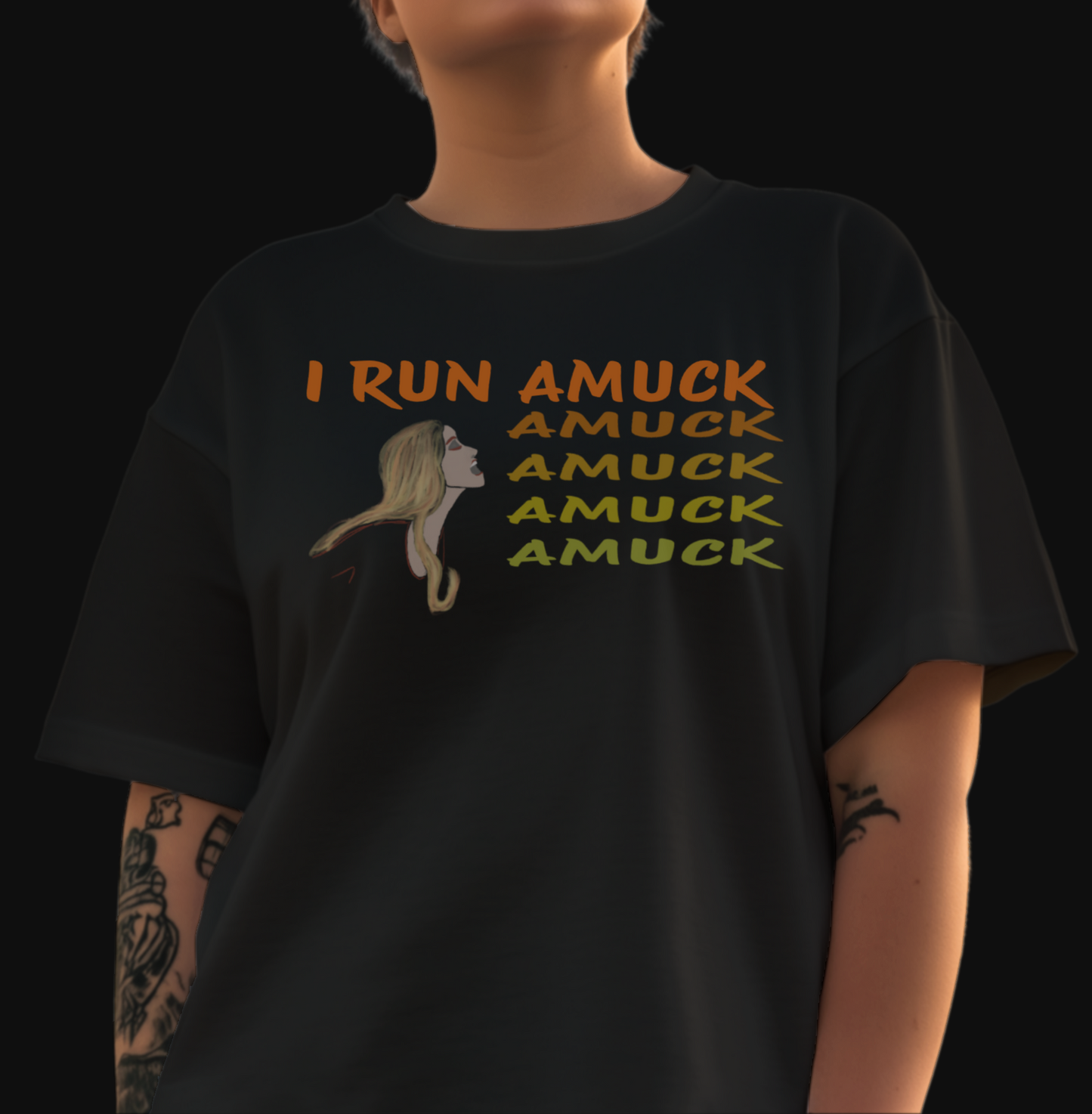 Black t-shirt with the words "I run amuck" printed in a bold font. Amuck is printed 4 more times in decreasing font gradient below "amuck" on the complete line. A cartoon blonde woman is under the words "I run" and is leaned, mouth opened, toward the amucks as if speaking them.